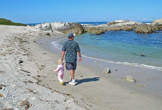 Walking on the beach with Daddy
